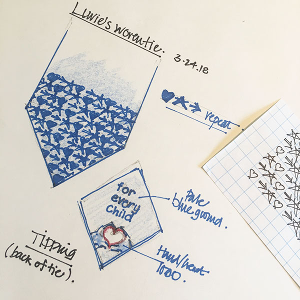 Hand-drawn design sketch in an artist's notebook